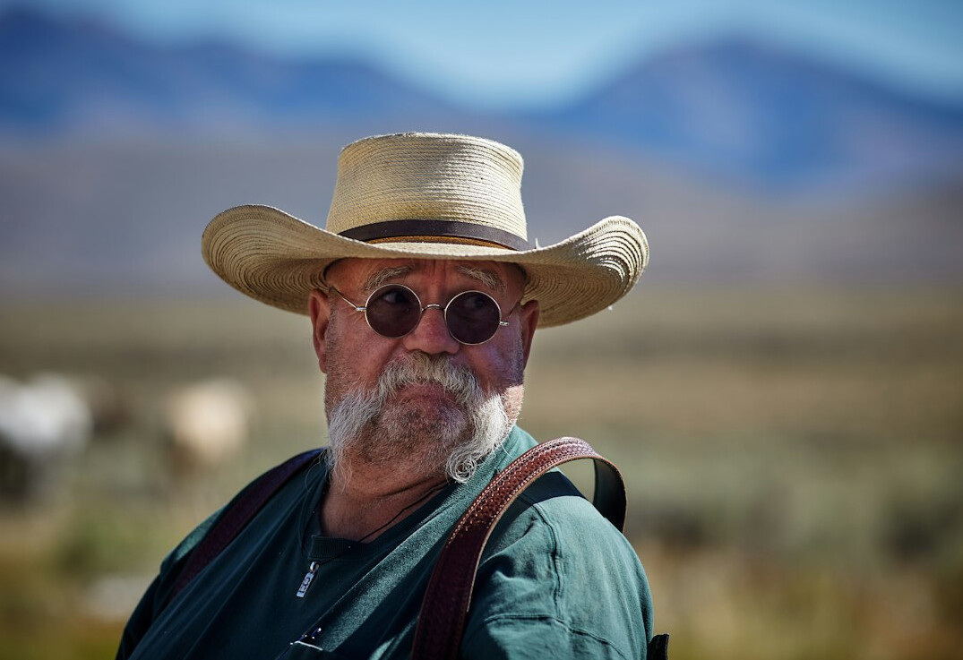 Portrait of an older Chilean man photographer with glasses